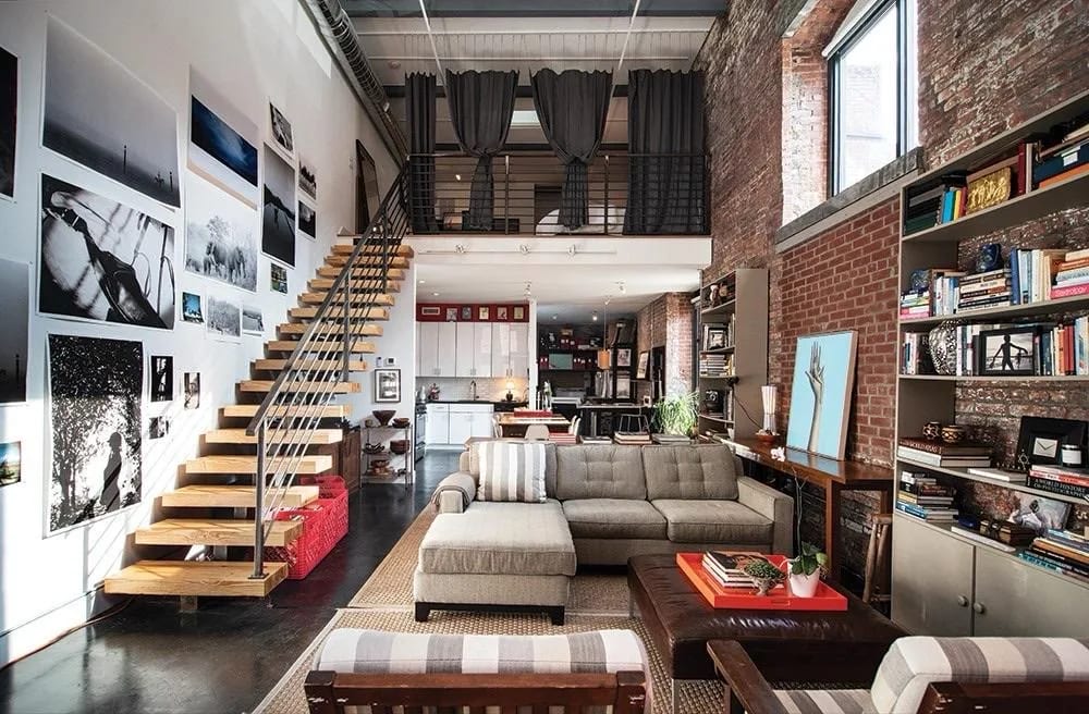Loft at Beacon with exposed brick, a wood staircase, and a mezzanine